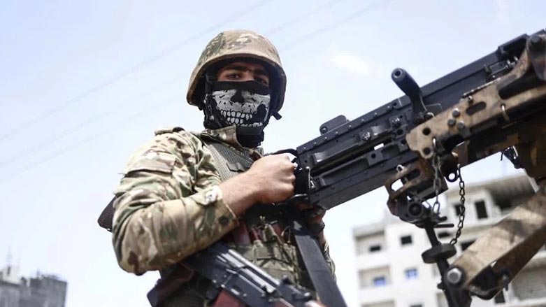 A fighter of the Turkish-backed Syrian National Army take part in a military parade in the countryside of Aleppo Governorate on June 9, 2022. (Photo:  AP/Anas Alkharboutli)