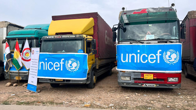 Trucks loading the UNICEF-provided Personal Protective Equipment are pictured during the handover ceremony, Dec. 12, 2022. (Photo: Nawras Abdulla/Kurdistan 24)