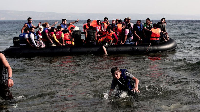 Refugees from Syria arrive on the shores of the Greek island of Lesbos aboard an inflatable dinghy across the Aegean Sea from Turkey, Sept. 7, 2015. (Photo: Angelos Tzortinis/AFP)