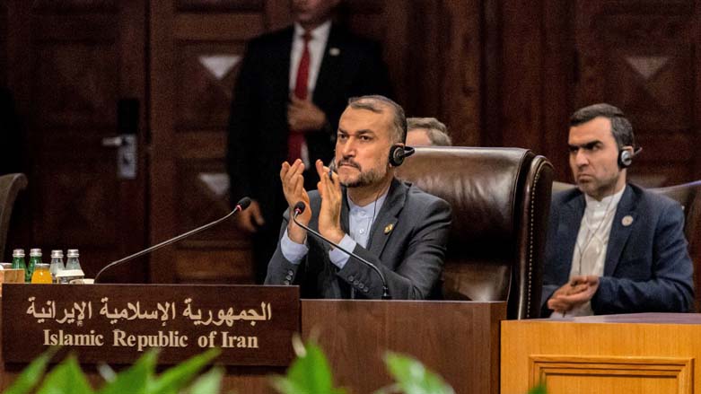 Iran's Foreign Minister Hossein Amir-Abdollahian (L) attending the