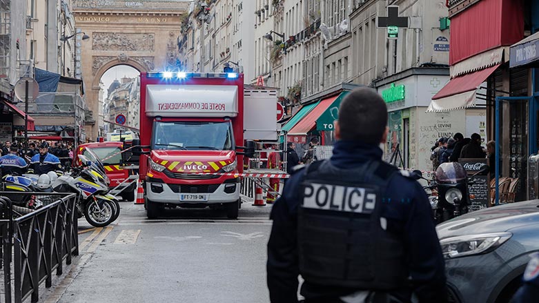 A police officer stands next to the cordoned off area where a shooting took place in Paris, Friday, Dec. 23, 2022. (Photo: Lewis Joly/ AP)