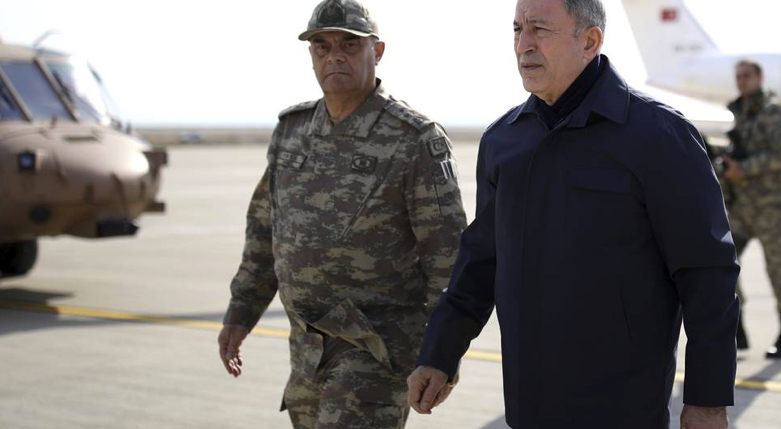 Turkey's National Defence Minister Hulusi Akar, right, arrives to inspect troops at the border with Syria in Hatay, Turkey, on Feb. 3, 2020. (Photo: Turkish Defence Ministry via AP, Pool)