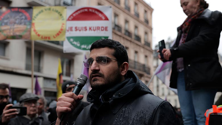 Agit Polat, spokesman of the Kurdish Democratic Counsel in France, speaks during a march to honor three women Kurdish activists who were shot dead in 2013, Monday, Dec. 26, 2022 in Paris. (Photo: Lewis Joly/ AP)