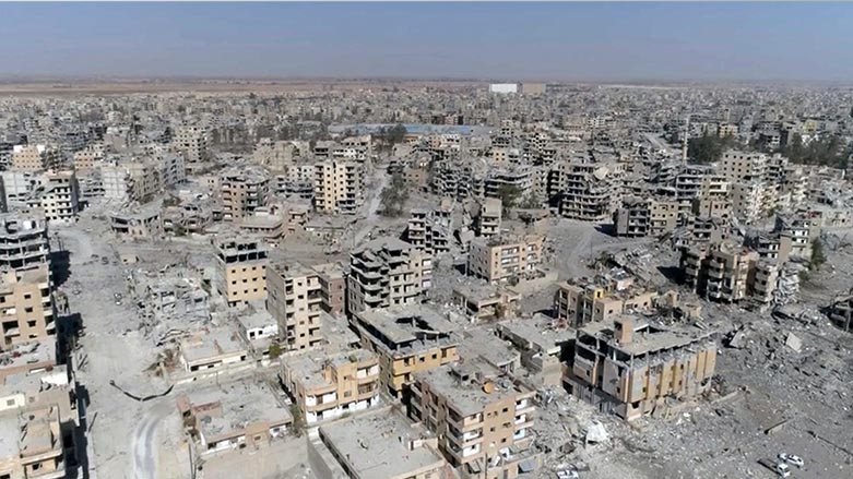 A frame grab made from drone video shows damaged buildings in Raqqa, Syria. (Photo: Gabriel Chaim/AP)