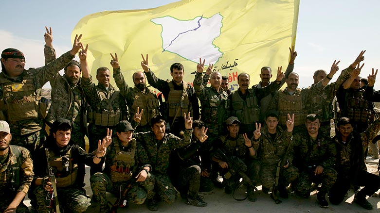 U.S.-backed Syrian Democratic Forces (SDF) fighters pose for a photo in Baghouz, Syria, after the SDF declared the area free of Islamic State militants. (Photo: Maya Alleruzzo/ AP)