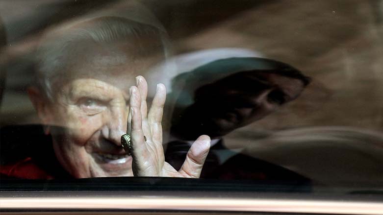 Pope Benedict XVI waves to believers through his car window as he leaves Brindisi after a two-day visit to the impoverished Apulia regio, June 15, 2008. (Photo: Filippo Monteforte/AFP)