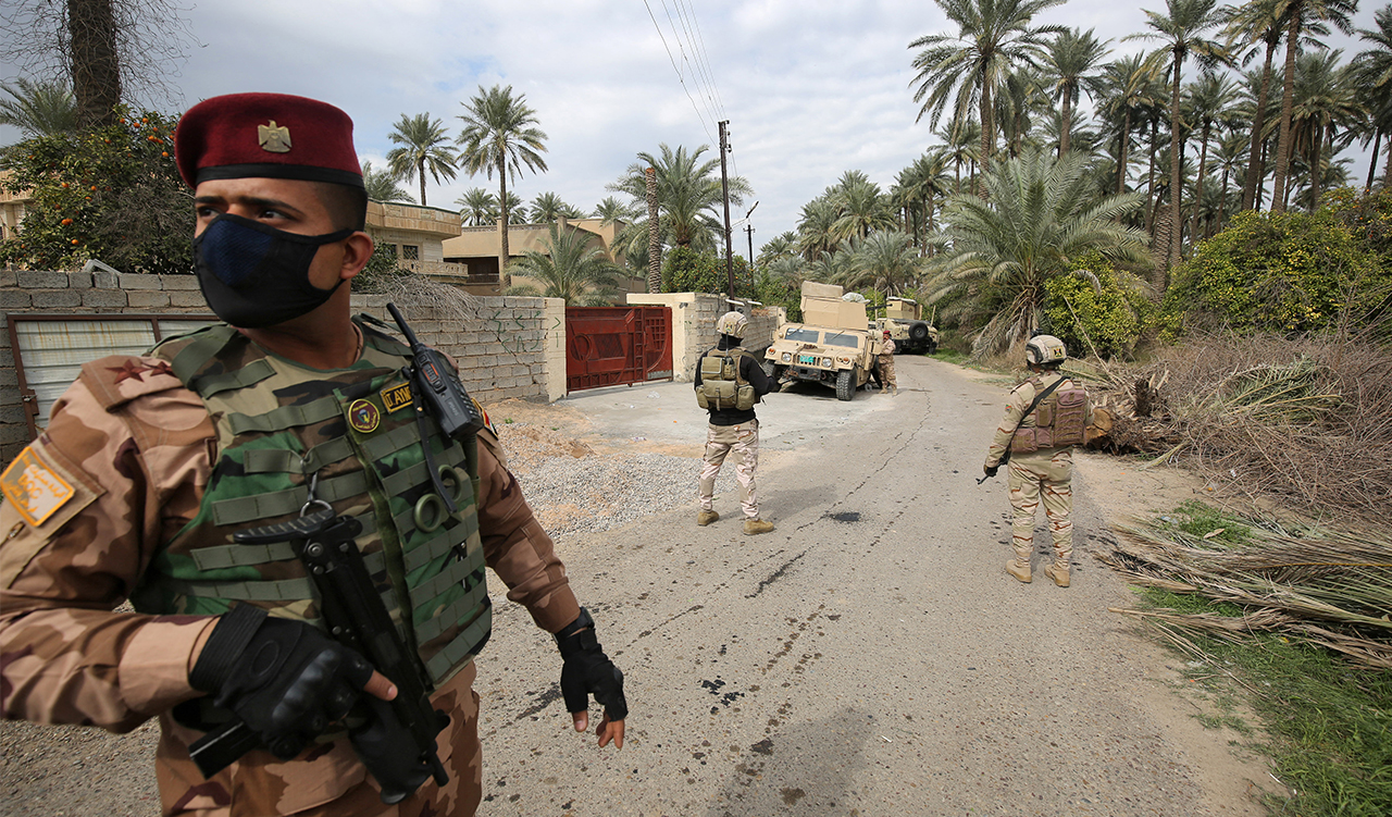 Iraqi forces search the area in Tarmiyah, north of Baghdad, following clashes with Islamic State group fighters, Feb. 20, 2021. (Photo: Ahmed Al-Rubaye/AFP)
