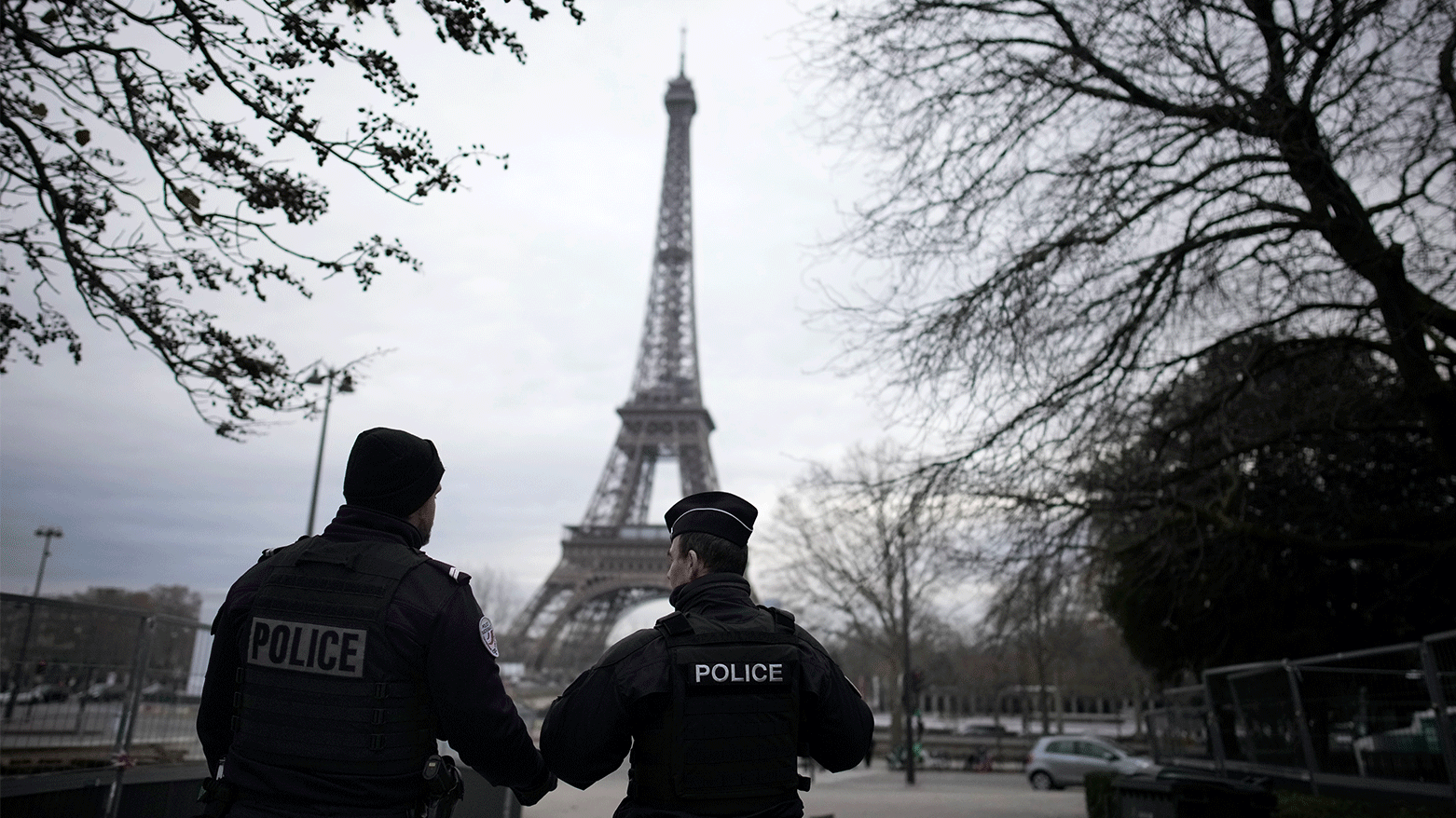 French policemen patrol near the Eiffel Tower after a man targeted passersbys late Saturday, killing a German tourist with a knife and injuring two others in Paris. (Photo: AP)
