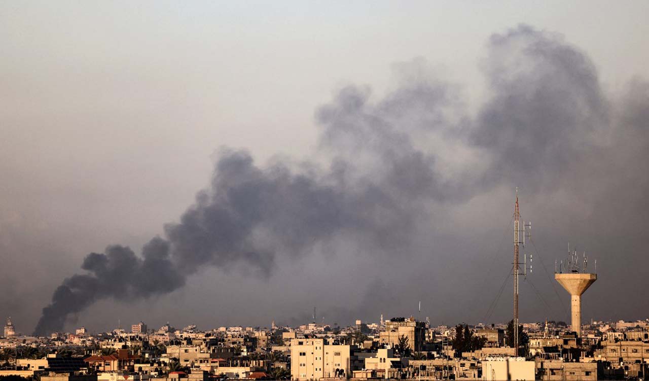 A picture taken from Rafah southern Gaza Strip shows smoke billowing during Israeli bombardment in Gaza, Dec. 6, 2023. (Photo: Mahmud Hamas/AFP)