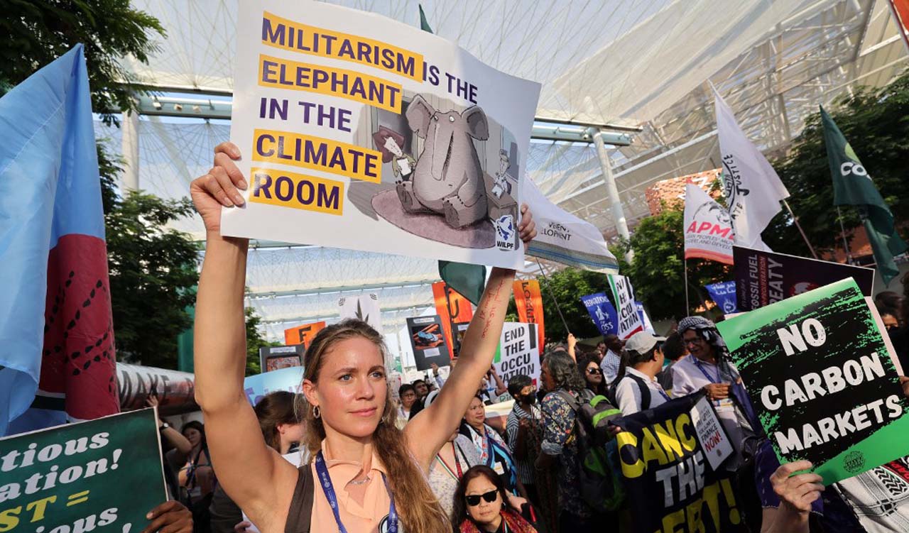 Climate activists gather for a joint 'climate justice' and 'ceasefire now' march, demanding an end to the violence in the Gaza Strip, at the United Nations climate summit in Dubai, Dec. 9, 2023. (Photo: Giuseppe Cacace/AFP)
