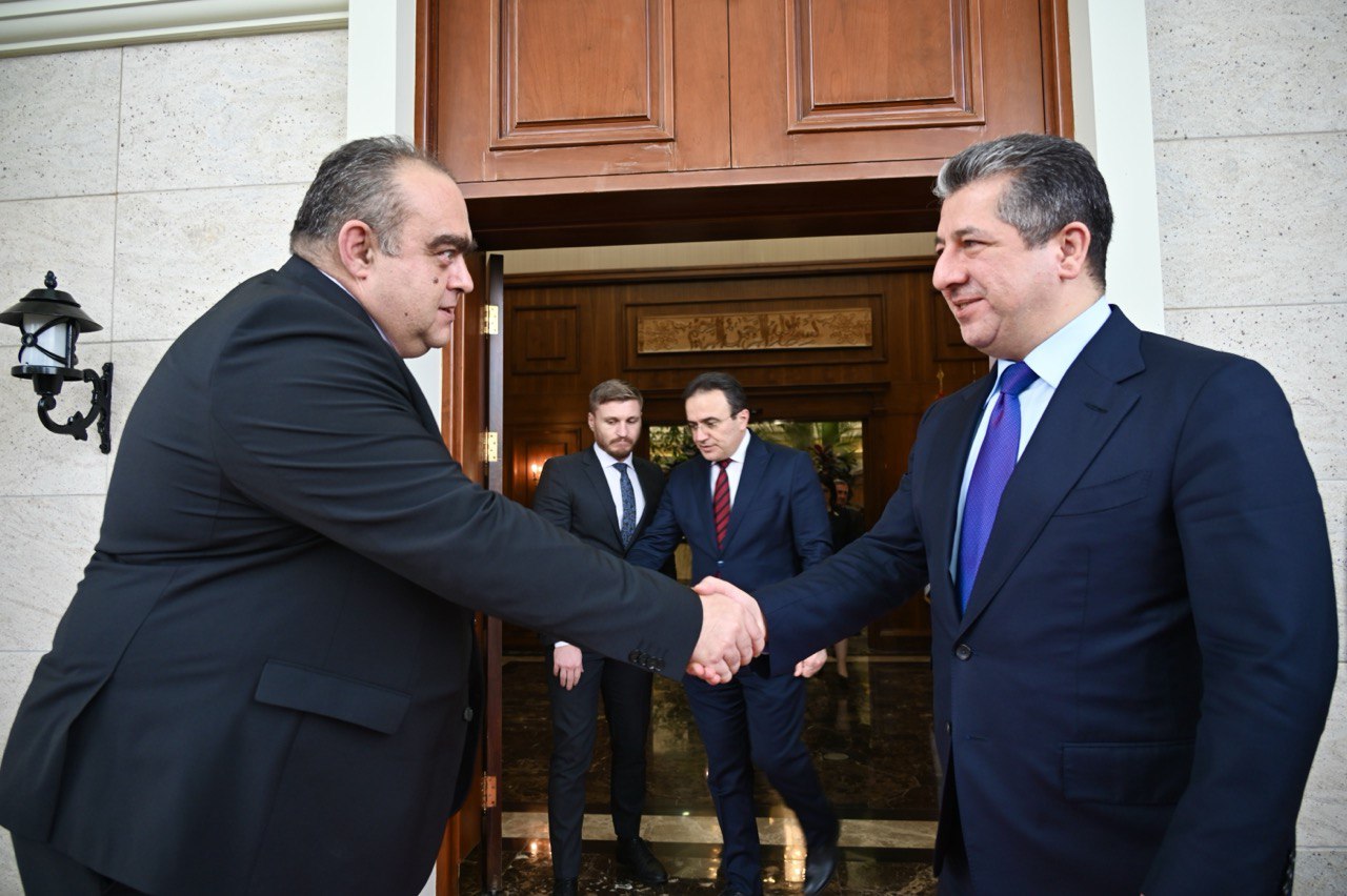 Kurdistan Region Prime Minister Masrour Barzani (right) shaking hands with the Ambassador of the Republic of Romania to Iraq, Radu-Octavian Dobre, Dec. 11, 2023. (Photo: KRG)