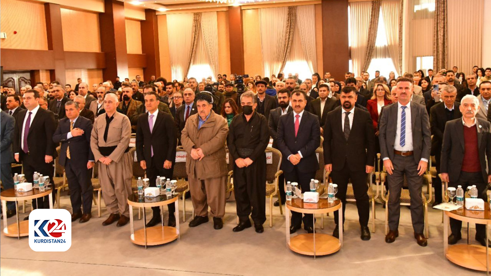 Attendees of the Genocide as Reflected in Literature and Art conference stand for the Kurdish anthem, Ey Reqib, Dec. 11, 2023. (Photo: Kurdistan 24)