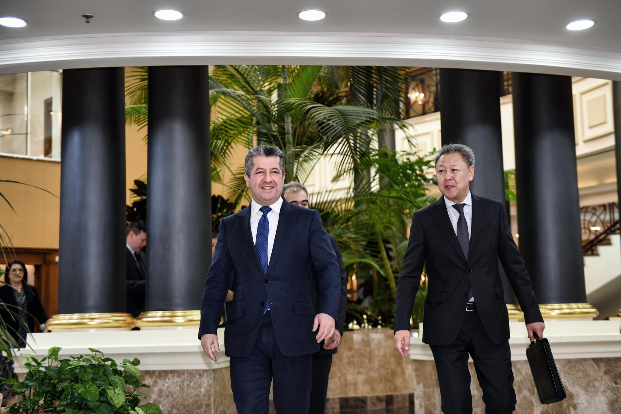 Kurdistan Region Prime Minister Masrour Barzani (left) walking alongside Kazakhstan Ambassador to Iraq and Jordan Aidarbek Toumatov in Erbil, Dec. 12, 2023. (Photo: KRG)