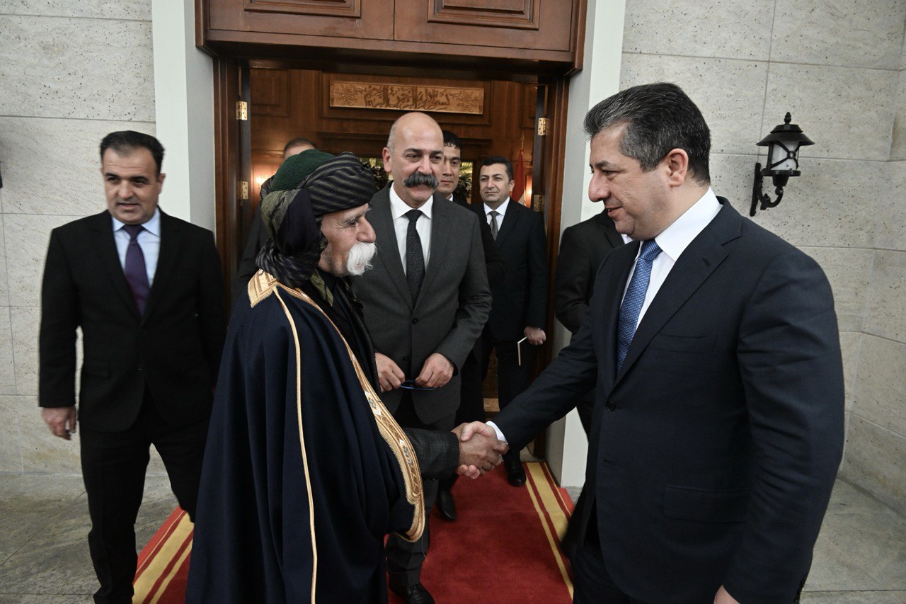 Kurdistan Region Prime Minister Masrour Barzani (right) shaking hands with Kaka'i religious figure Said Raheem Said Azim, Dec. 13, 2023. (Photo: KRG)