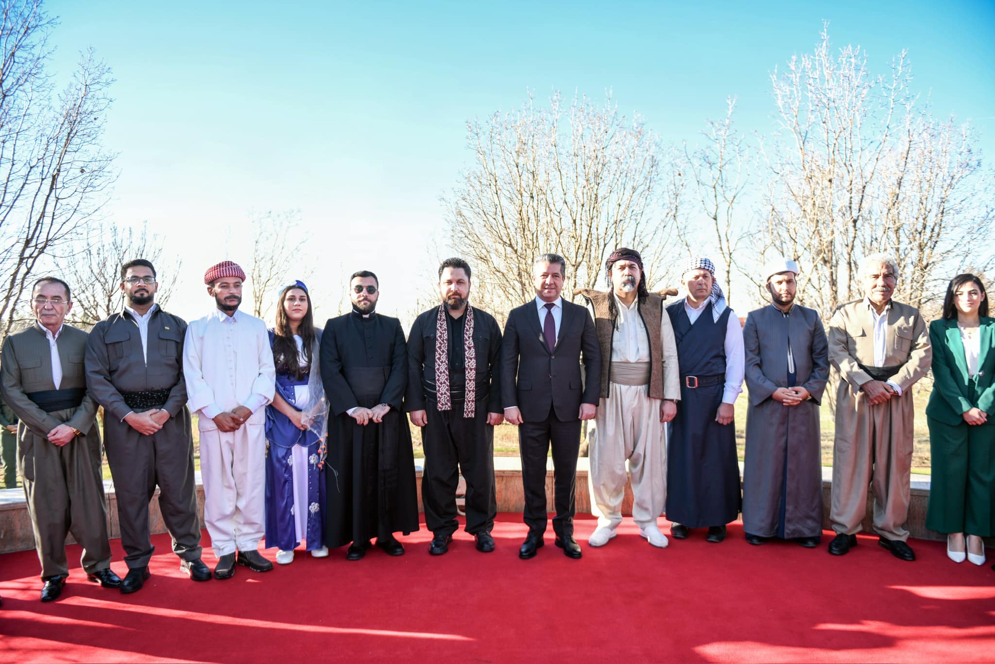 Kurdistan Region Prime Minister Masrour Barzani (sixth from right) standing for a group photo with members of the Kurdistan Region diverse components in Erbil to mark Kurdistan Flag Day, Dec. 17, 2023. (Photo: KRG)