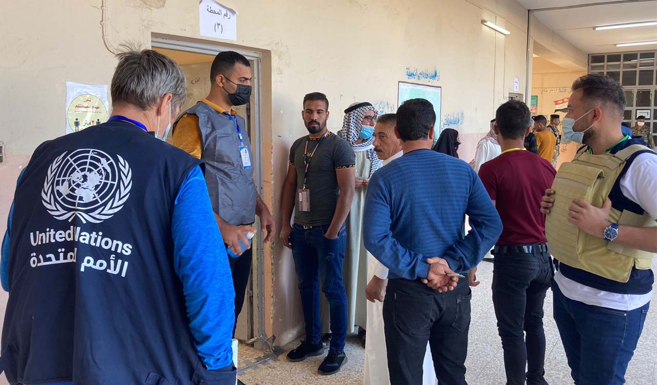 UN electoral observers are seen at a polling station in Iraq during October 2021 parliamentary election. (Photo: UNAMI)