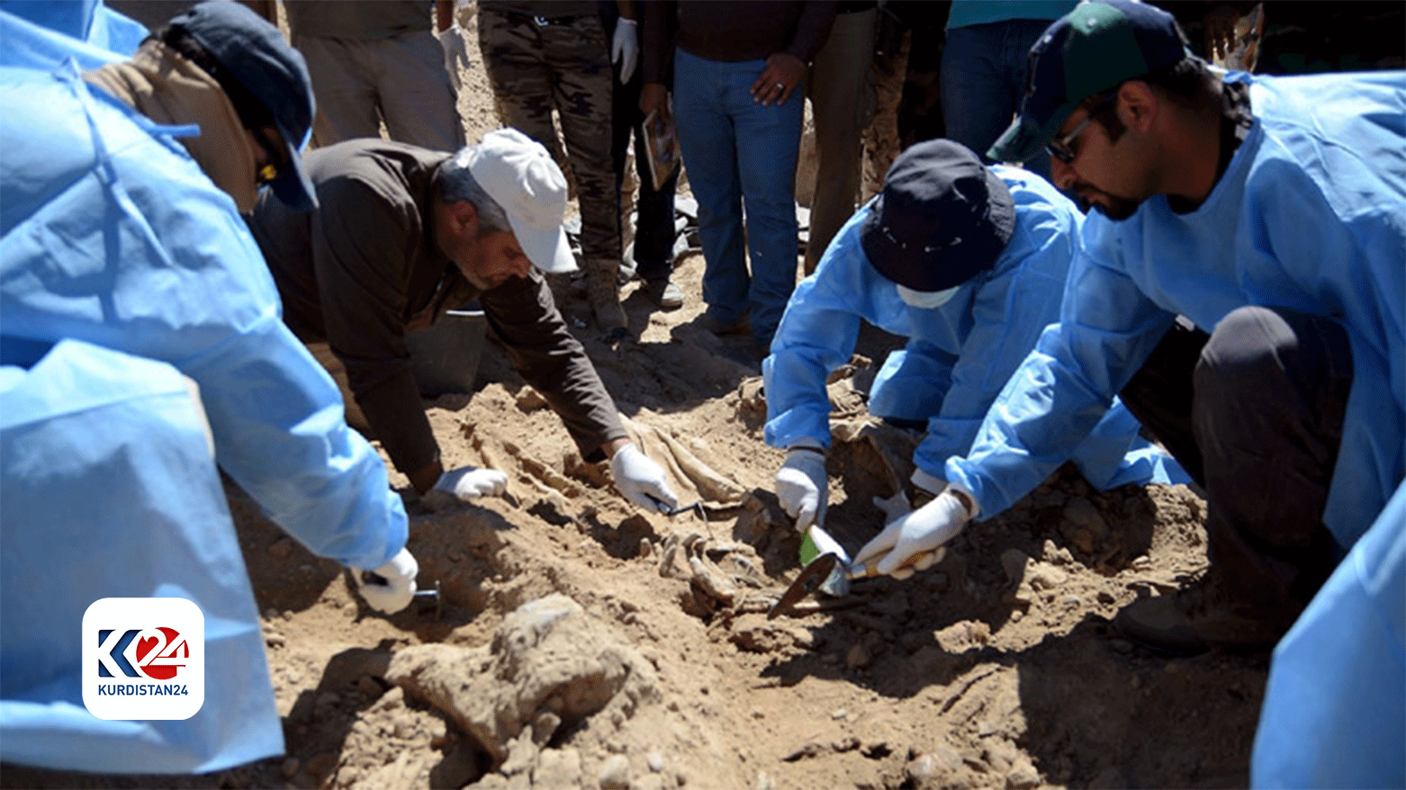 Iraqi forensics teams exhume human bodies from a mass grave site near Camp Speicher. (Photo: Kurdistan 24)