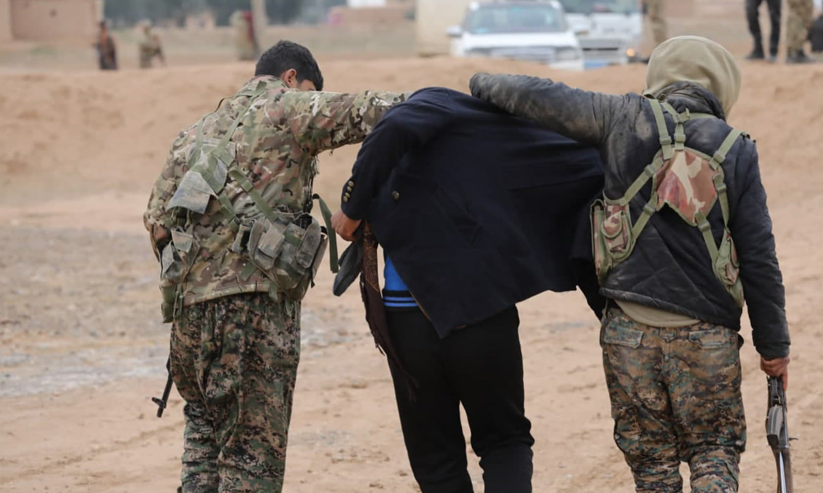 SDF fighters arrest an ISIS suspect during operation in Deir al-Zor (Photo: YPG Press Office)