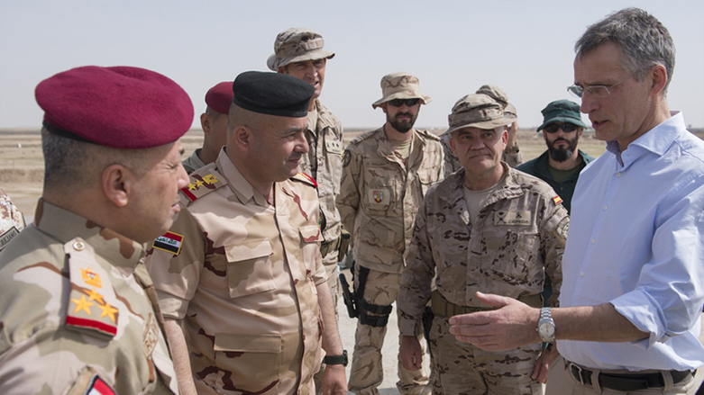 NATO Secretary General Jens Stoltenberg talks to NATO trainers and Iraqi troops during a visit to the NATO Training Camp in Iraq, Mar. 5, 2018. (Photo: NATO)