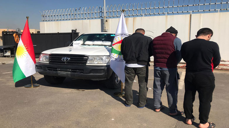 Suspects are pictured along with the confiscated illicit drugs, Feb. 22, 2021. (Photo: Erbil security forces media office)