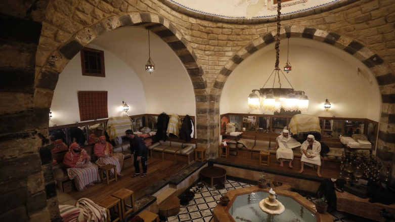 Patrons sit in a public bathhouse in Damascus, Syria, Saturday, Jan. 22, 2022. Syria's traditional public bathhouses, known as Hammamat, are picking up steam again due to electricity cuts during a particularly cold winter. (Photo: AP/Omar S