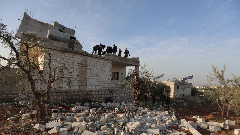 Syrians gather on Feb. 3, 2022 at the scene following an overnight raid by US special operations forces against suspected terrorists in Syria's northwestern province of Idlib. (Photo: Aaref Watad / AFP)