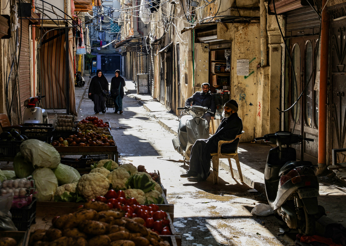 People gather in a street in the northern Lebanese city of Tripoli's empoverished neighbourhood of Bab al-Tabbaneh, Jan. 17, 2022. (Photo: Joseph Eid/AFP)