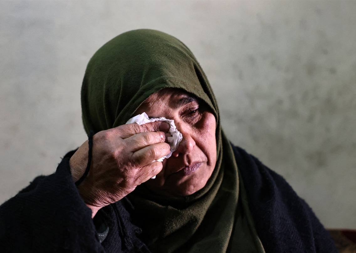 Ghufran, 56, the mother of Zakaria al-Adl, a member of the Islamic State (IS) group killed in Iraq, wipes her tears, Jan. 17, 2022. (Photo: Joseph Eid/AFP)