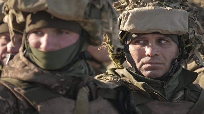 Ukrainian servicemen wait in formation before an exercise in the Joint Forces Operation, in the Donetsk region, eastern Ukraine, Tuesday, Feb. 15, 2022. (Photo: Vadim Ghirda/AP)