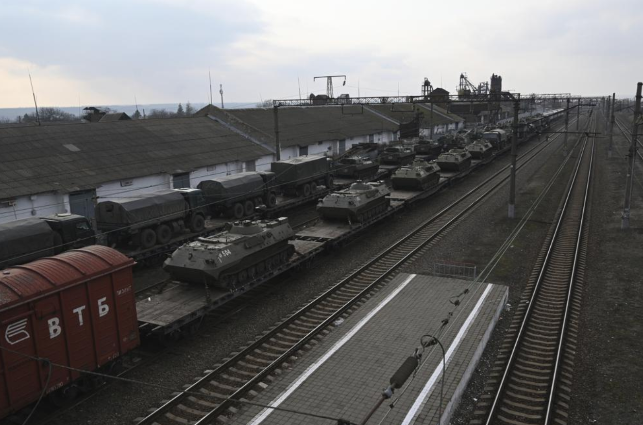 Russian armored vehicles are loaded onto railway platforms at a railway station in region not far from Russia-Ukraine border, in the Rostov-on-Don region, Russia, Wednesday, Feb. 23, 2022. (Photo: AP)