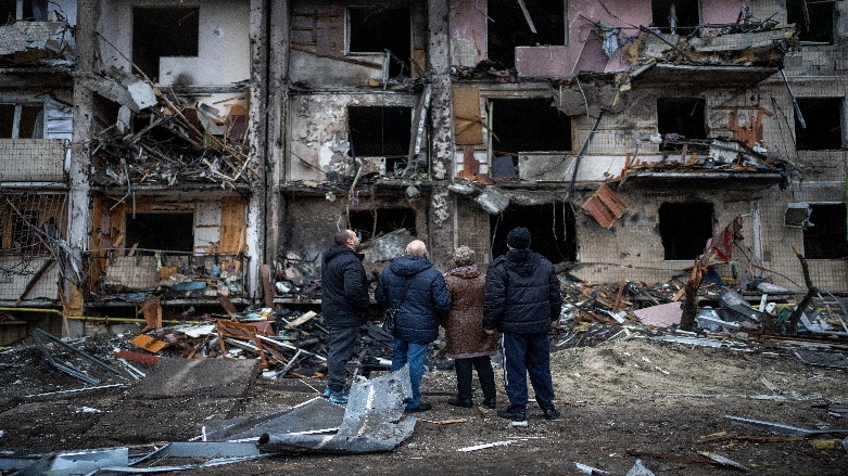 People look at the damage following a rocket attack the city of Kyiv, Ukraine, Friday, Feb. 25, 2022. (Photo: Emilio Morenatti/AP)