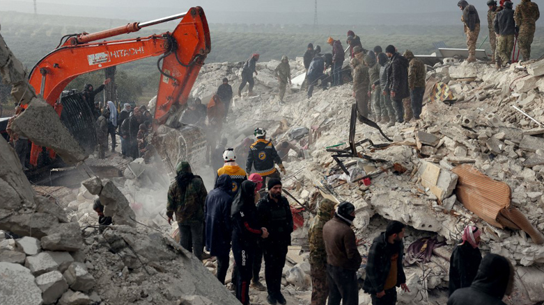 Residents and rescuers search for victims and survivors amidst the rubble of collapsed buildings in Syria's rebel-held northwestern Idlib province on the border with Turkey, Feb. 6, 2022. (Photo: Omar Haj Kadour/AFP)