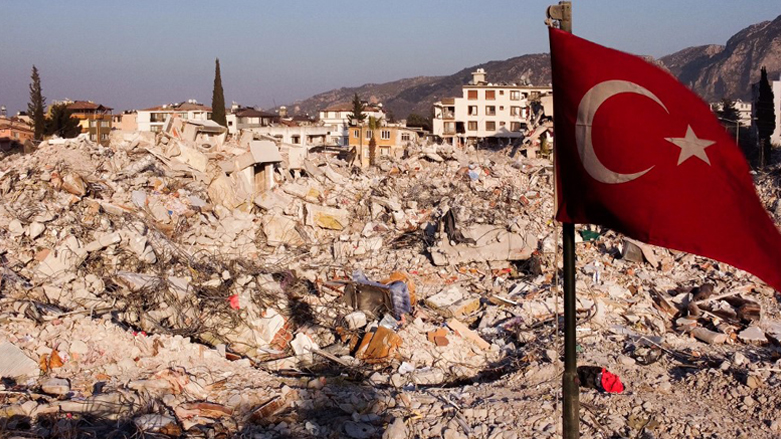 a Turkish flag waving over rubbles of destroyed buldings in Antakya, Hatay, a week after a deadly earthquake struck parts of Turkey and Syria, Feb. 14, 2023. (Photo: Hassan Ayadi/AFP)