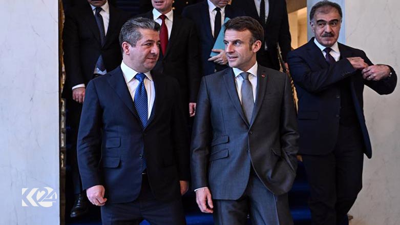 Kurdistan Region Prime Minister Masrour Barzani (left) walks with French President Emmanuel Macron, Feb. 16, 2023. (Photo: KRG)
