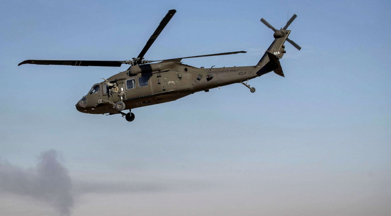 In this file photo from 2019, a helicopter takes off from a US military base at an undisclosed location in Syria (Photo: Darko Bandic/AP)