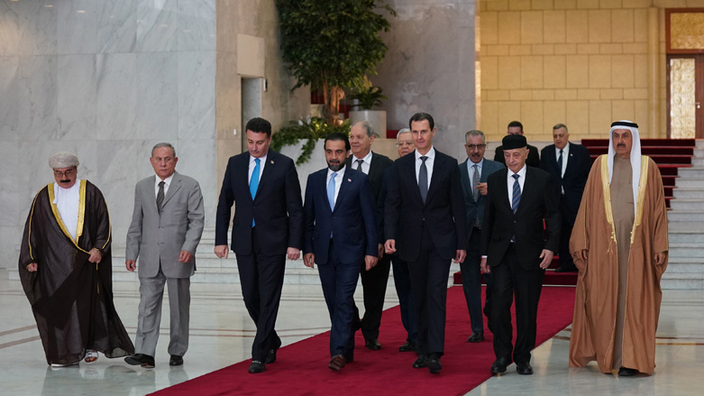 Syrian President Bashar Al-Assad (third from right) walking along with Arab parliamentary leaders in Damascus, Feb. 26, 2023. (Photo: Syrian Arab News Agency)