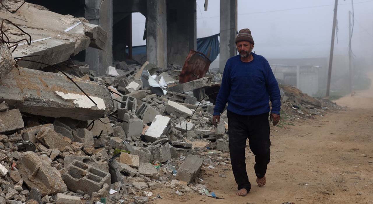 A man walks past a building destroyed in Israeli bombing, in Rafah in the southern Gaza Strip, Feb. 9, 2024. (Photo: Mohammed Abed/AFP