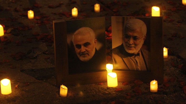 Supporters of Iranian-backed PMF militias hold a candlelight vigil at the site of the Jan. 3, 2020, US drone strike that killed Iranian General Qasim Solemani and PMF leader Abu Mahdi al-Muhandis, Jan. 2, 2021. (Photo: AFP/Ahmad al-Rubaye)