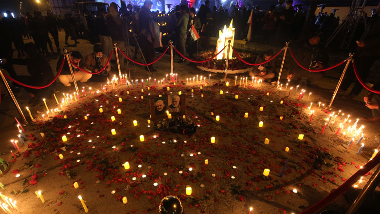 Supporters of the Hashed al-Shaabi hold a candlelight vigil at the site of the January 3, 2020 US drone strike on Qasem Solemani, Jan. 2, 2021. (Photo: Ahmad al-Ruabye / AFP)