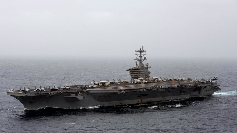 The aircraft carrier Nimitz will remain in the Middle East for longer than previously ordered. (Photo: Associated Press/Mass Communication Specialist 3rd Class Elliot Schaudt/US Navy)