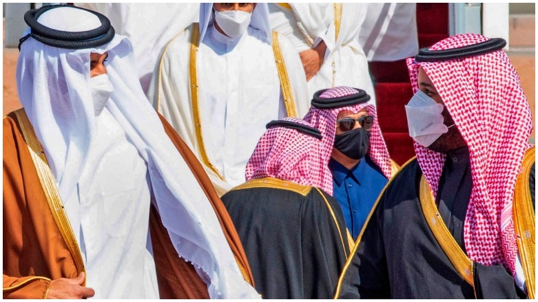 Crown Prince Mohammed bin Salman (right) welcomes the emir of Qatar, Tamim bin Hamad al-Thani, at the airport in Al-Ula, Saudi Arabia. (Photo: AFP/Bandar al-Jaloud)