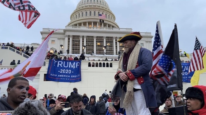 Protestors wave American flags outside of the US Capitol in Washington, DC, on Jan. 6, 2021. (Photo: Kurdistan 24)