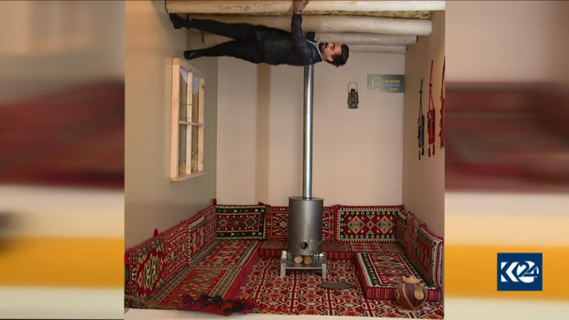 A man is seen to walk on a wall of a room. (Photo: Kurdistan 24)
