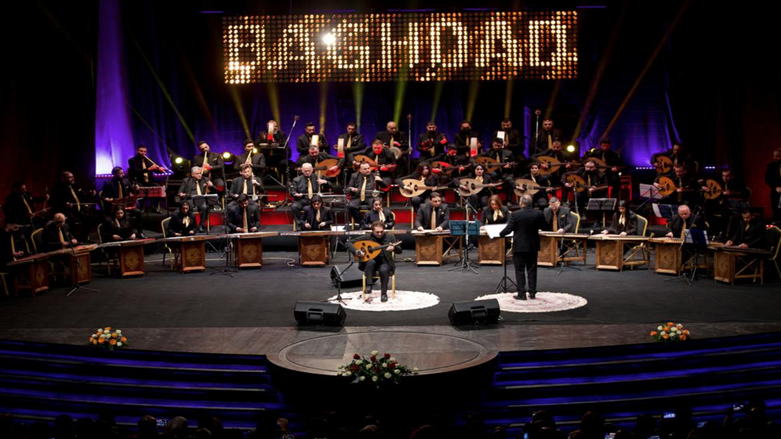 Iraqi virtuoso oud player Naseer Shamma performs with an orchestra -- half of them young women musicians -- at the Iraqi National Theater in Baghdad, Iraq, Friday, Jan. 21, 2022 (Photo: Hadi Mizban/AP)