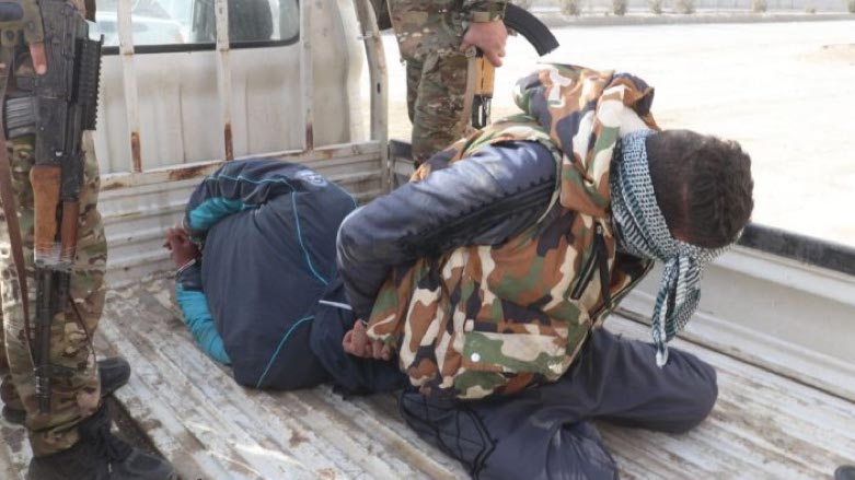 ISIS fighter captured by the SDF near the al-Sina’a prison (Photo: SDF Media Center)