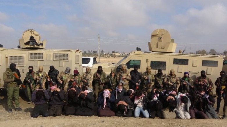 The 27 ISIS suspects detained by US-led SDF fighters in the Raqqa countryside. (Photo: SDF’s Coordination and Military Operations Center)
