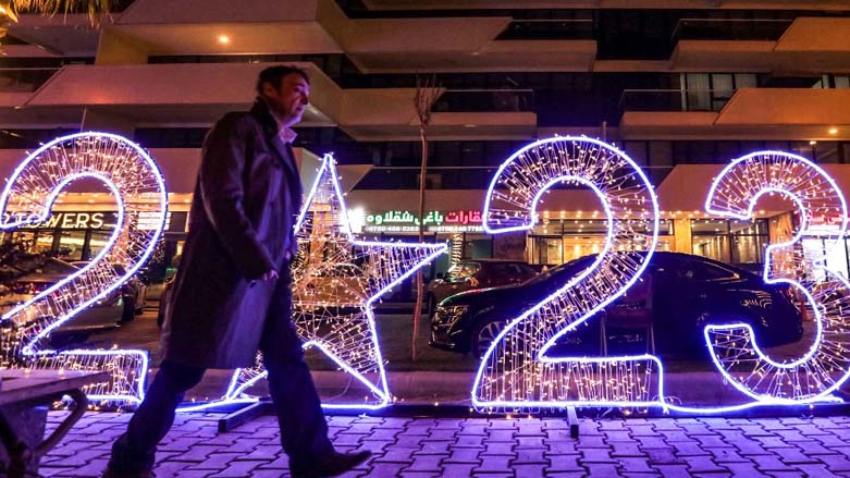 A man walks near a lit installation depicting the number for the year "2023" placed as part of new year decorations in Erbil, Dec. 29, 2022. (Photo: Safin Hamed/AFP)