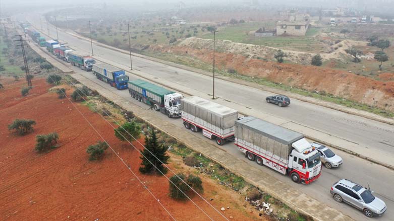 An aerial view shows trucks carrying aid packages from the World Food Program (WFP) driving through the rebel-held northwestern city of Idlib, Jan. 8, 2023. (Photo: Omar Haj Kadour/AFP)