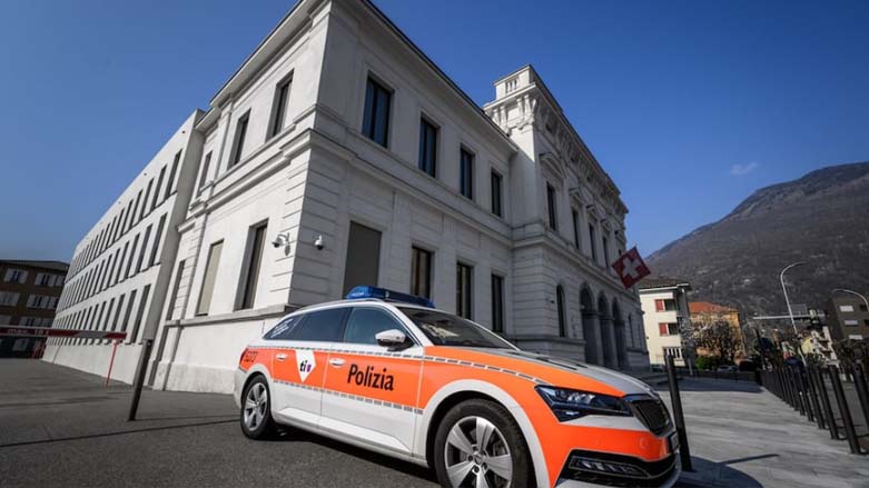 A police car is parked next to the Swiss criminal court. (Photo: Fabrice Coffrini/AFP)