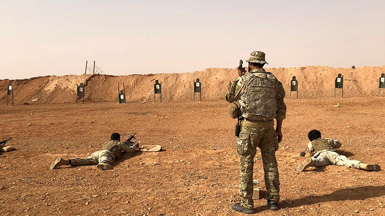 Members of the Maghawir al-Thawra Syrian opposition group receive firearms training from U.S. Army Special Forces soldiers at the al-Tanf military outpost in southern Syria on Monday, Oct. 22, 2018. (Photo: Lolita Baldor/ AP)